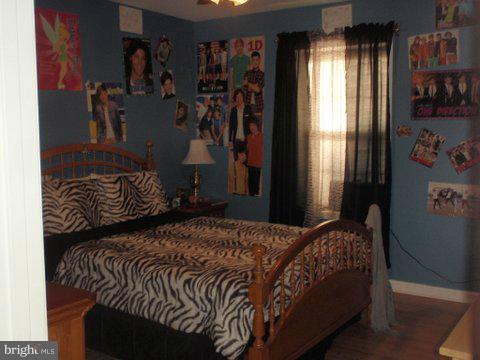 5169 Courtneys Corner Road Sumerduck, VA 22742 - Photo 21 of 29 a bedroom with a bed and a window