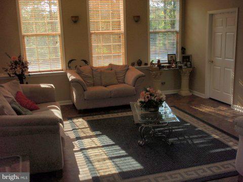 5169 Courtneys Corner Road Sumerduck, VA 22742 - Photo 22 of 29 a living room with furniture and a table