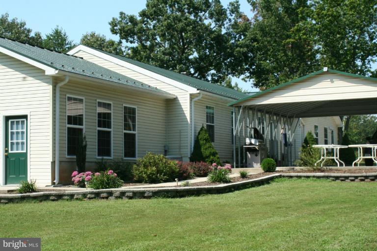 5169 Courtneys Corner Road Sumerduck, VA 22742 - Photo 5 of 29 a view of a house with backyard porch and garden