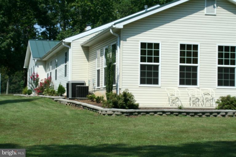 5169 Courtneys Corner Road Sumerduck, VA 22742 - Photo 6 of 29 a front view of a house with a yard