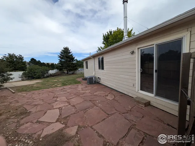 a view of a back yard of the house