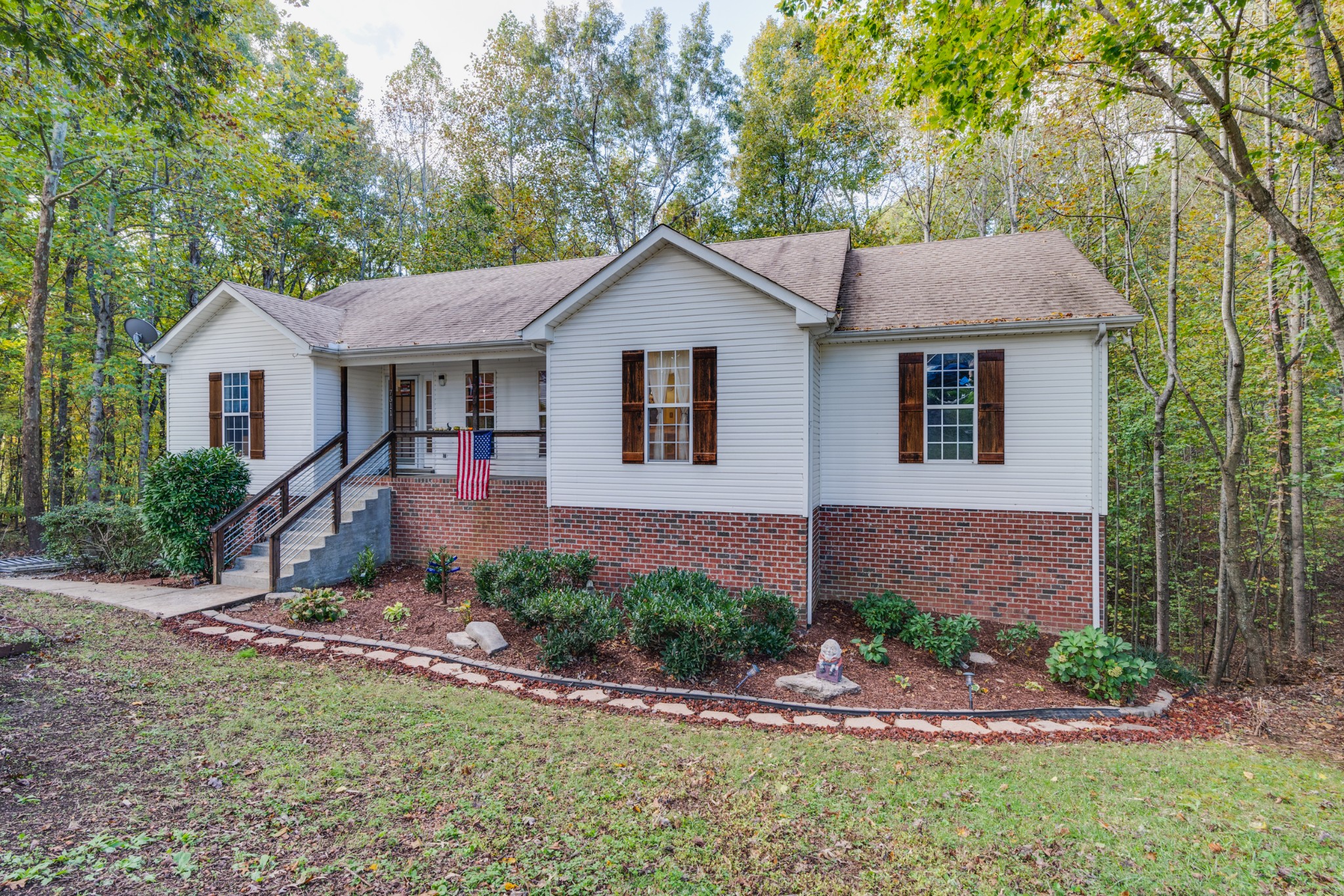 7511 Aubrey Ridge Place Fairview, TN 37062 - Photo 1 of 32 a front view of a house with garden