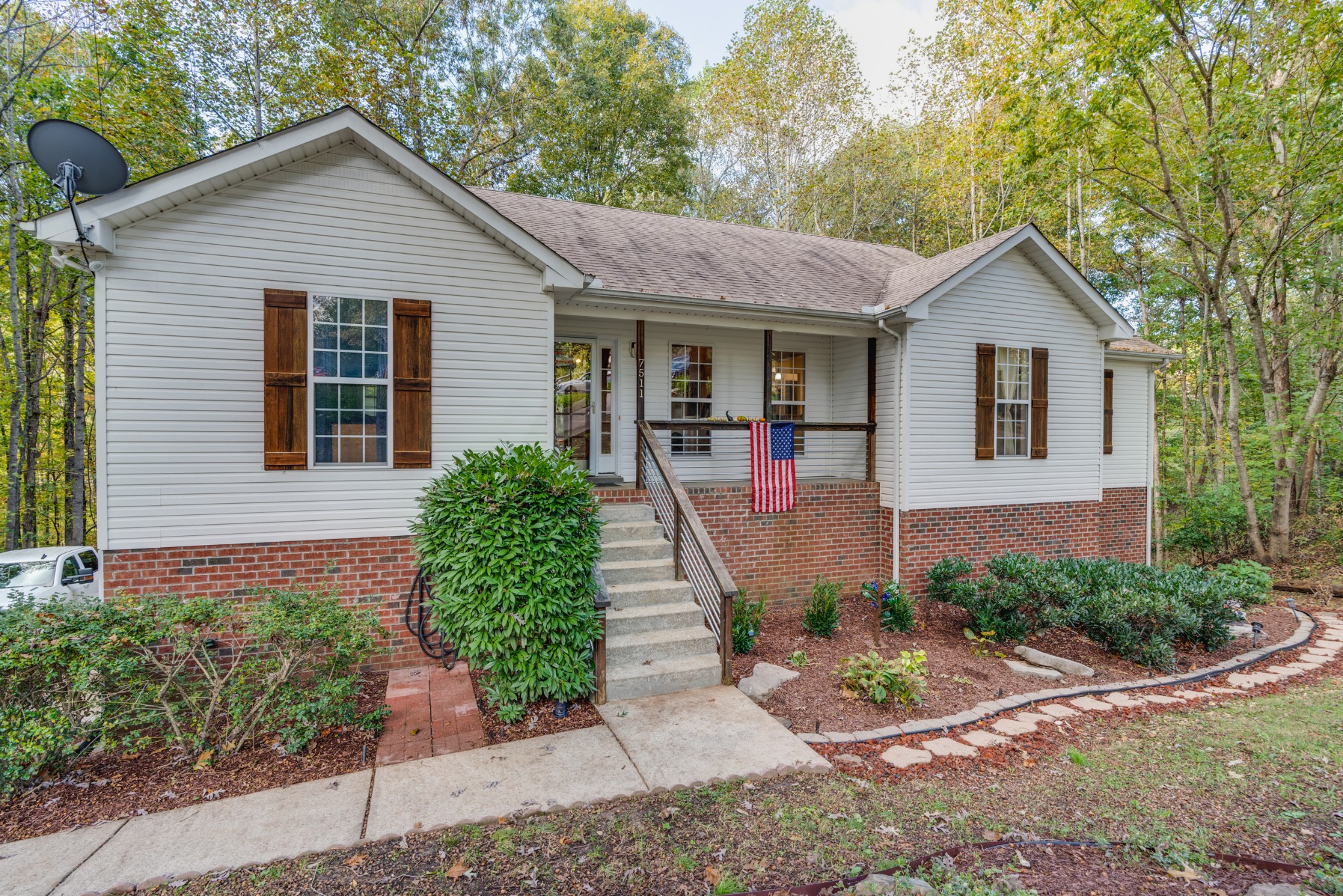 7511 Aubrey Ridge Place Fairview, TN 37062 - Photo 2 of 32 a front view of a house with a yard and potted plants
