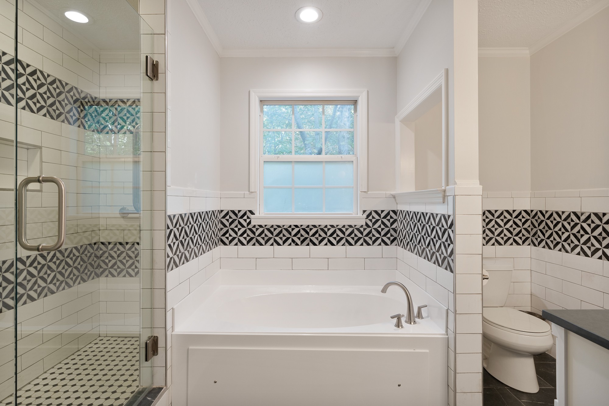 7511 Aubrey Ridge Place Fairview, TN 37062 - Photo 16 of 32 a bathroom with a bathtub and shower