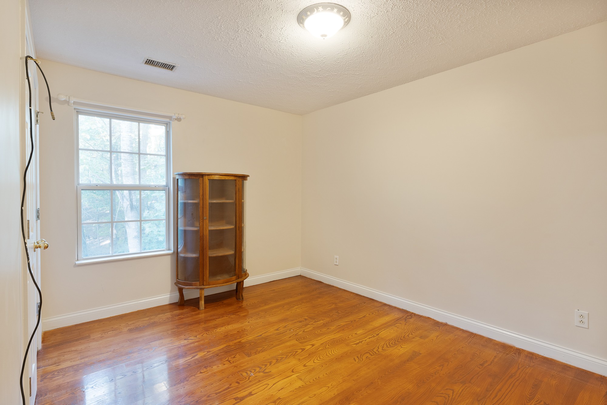 7511 Aubrey Ridge Place Fairview, TN 37062 - Photo 18 of 32 an empty room with wooden floor and windows