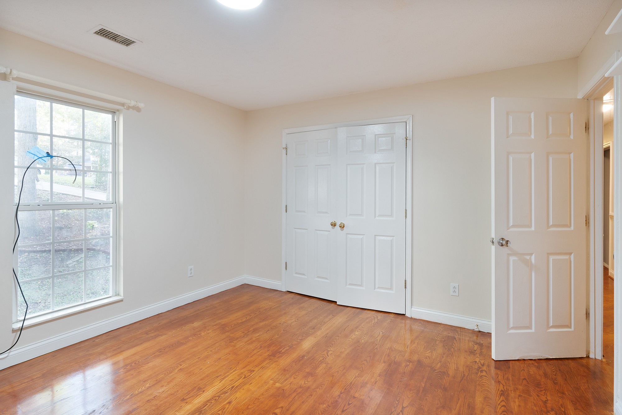 7511 Aubrey Ridge Place Fairview, TN 37062 - Photo 22 of 32 a view of empty room with wooden floor and fan