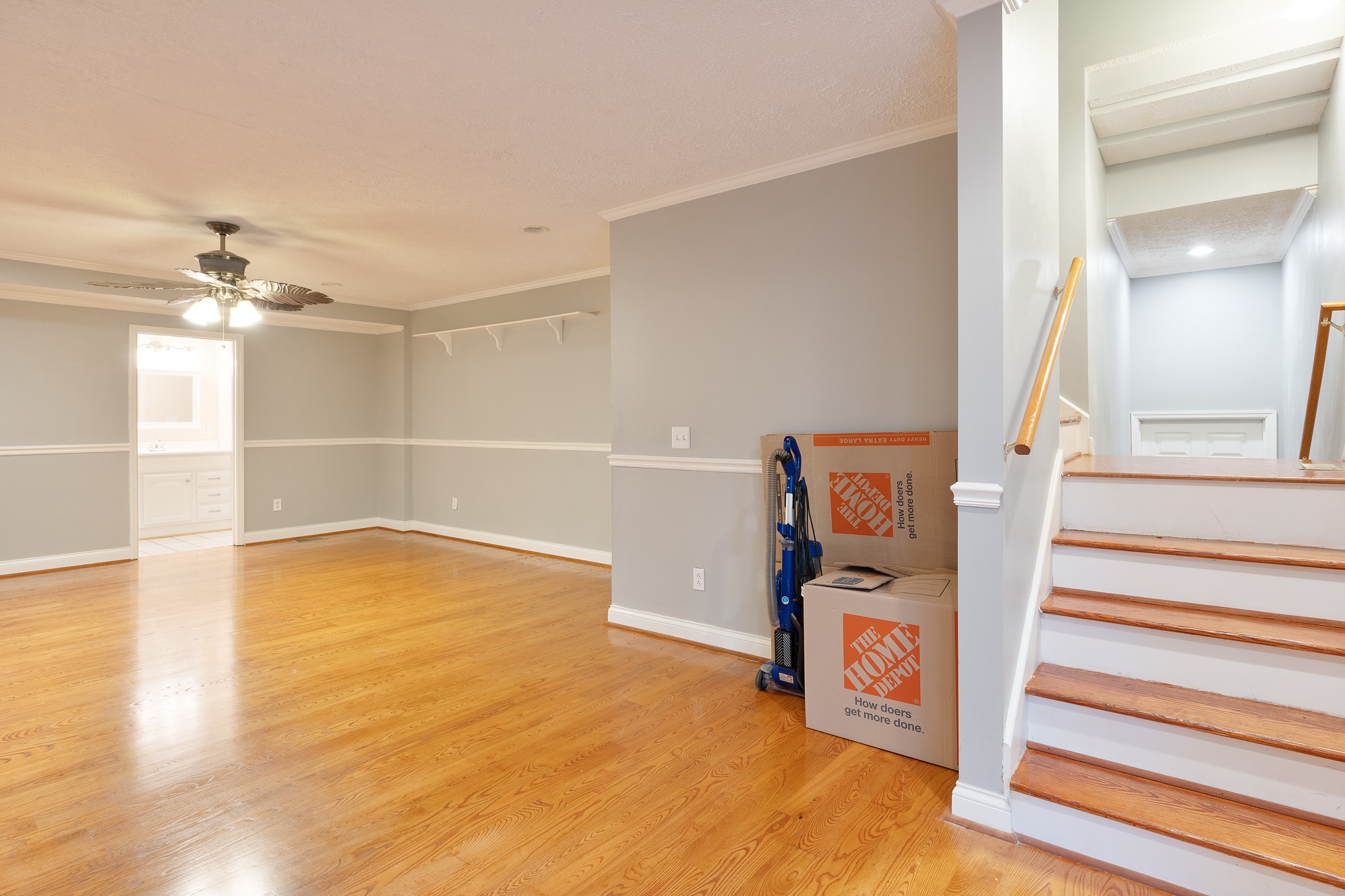 7511 Aubrey Ridge Place Fairview, TN 37062 - Photo 23 of 32 a view of an empty room with stairs and wooden floor