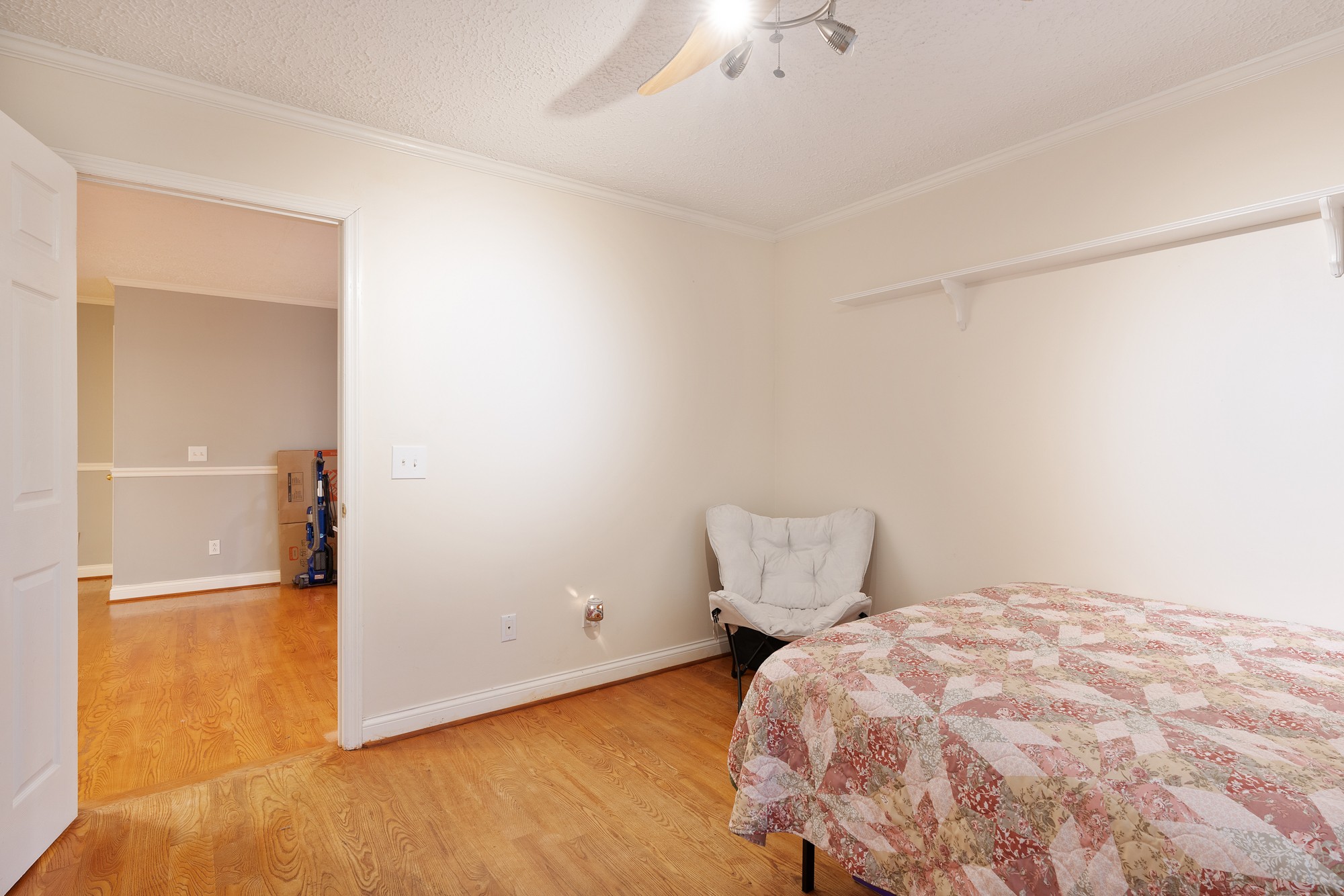 7511 Aubrey Ridge Place Fairview, TN 37062 - Photo 26 of 32 a bedroom with a bed and wooden floor
