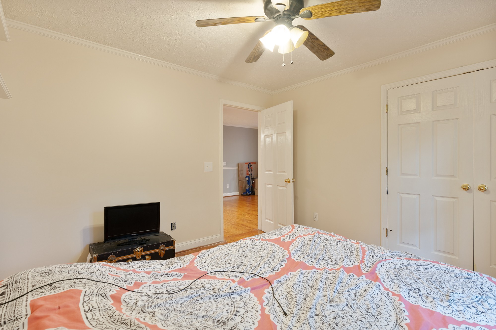 7511 Aubrey Ridge Place Fairview, TN 37062 - Photo 28 of 32 a bedroom with a bed and a chandelier