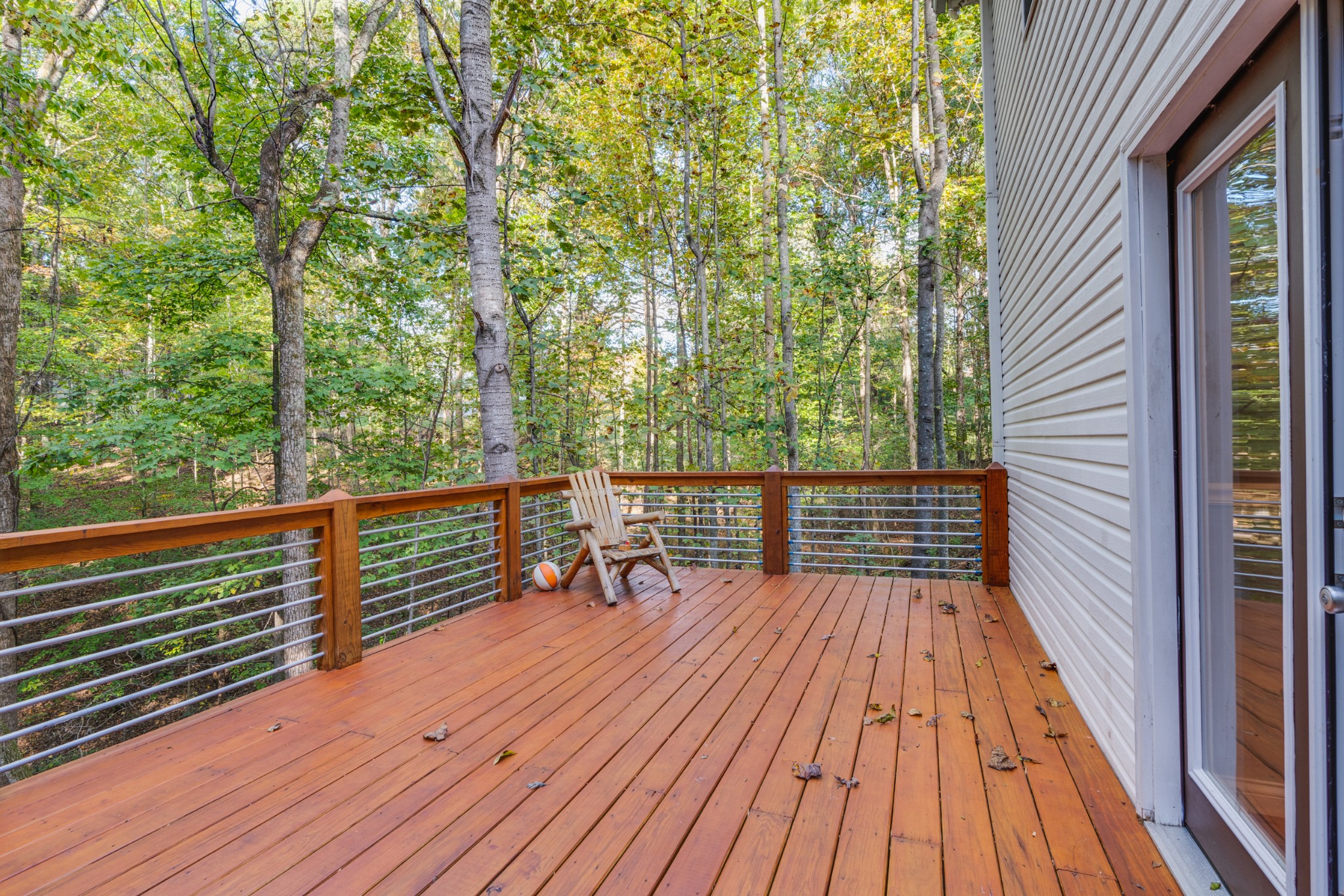 7511 Aubrey Ridge Place Fairview, TN 37062 - Photo 6 of 32 a view of deck with a table and chairs and wooden floor