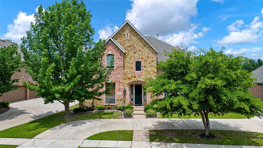 18 Ridgewood Drive Trophy Club, TX 76262 - Photo 1 of 1 a front view of a house with a garden