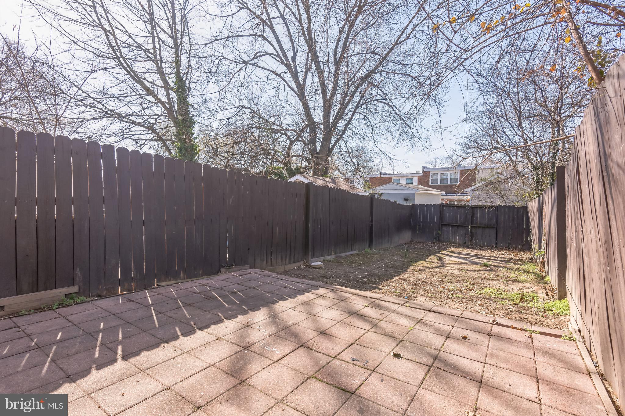815 Fifth Avenue Baltimore, MD 21227 - Photo 16 of 17 a view of backyard with wooden fence