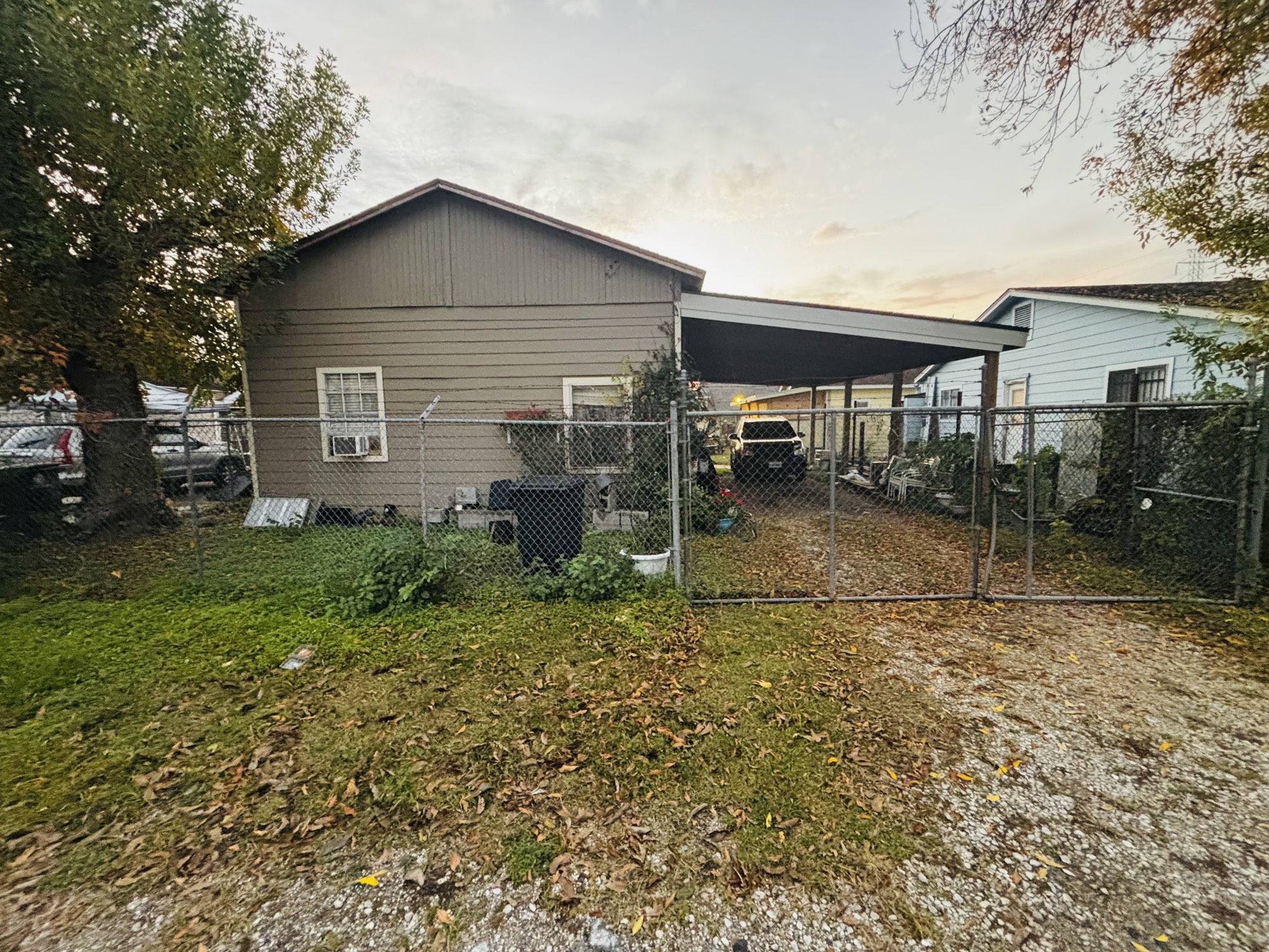 920 Frisco Street Houston, TX 77022 - Photo 2 of 11 a backyard of a house with plants and large tree