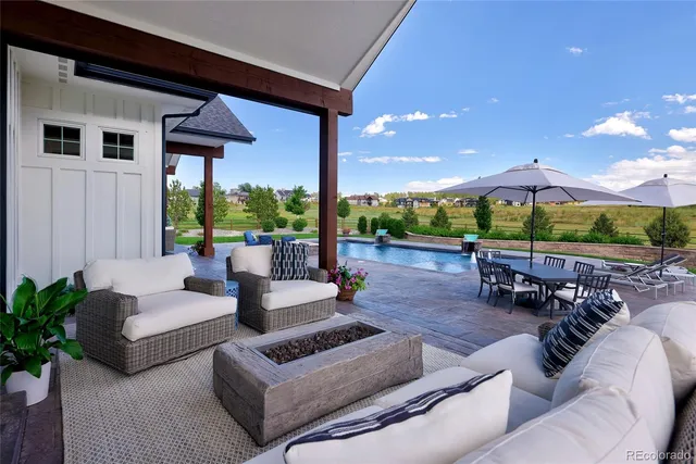 a view of a swimming pool with lounge chair