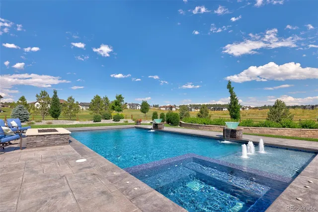 a view of a patio with a table and chairs