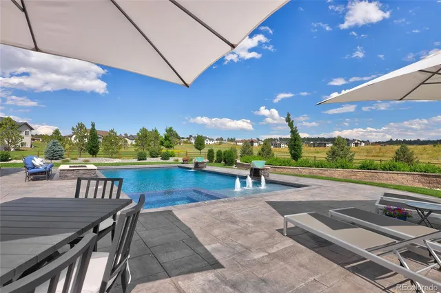 a view of a patio with swimming pool