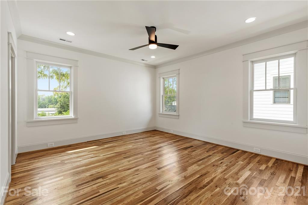 3807 Plainview Road Charlotte, NC 28208 - Photo 16 of 28 a view of an empty room with wooden floor and a window