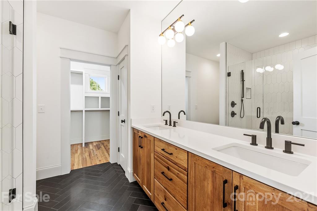 3807 Plainview Road Charlotte, NC 28208 - Photo 17 of 28 a spacious bathroom with a double vanity sink mirror and