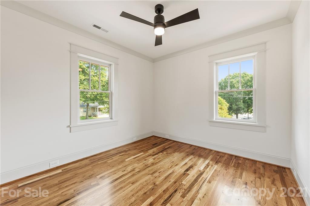 3807 Plainview Road Charlotte, NC 28208 - Photo 20 of 28 a view of empty room with wooden floor and fan