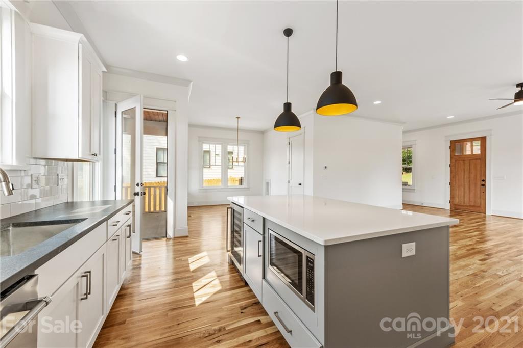 3807 Plainview Road Charlotte, NC 28208 - Photo 7 of 28 a kitchen with stainless steel appliances granite countertop a sink and a stove