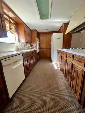 a view of a kitchen with furniture and a window