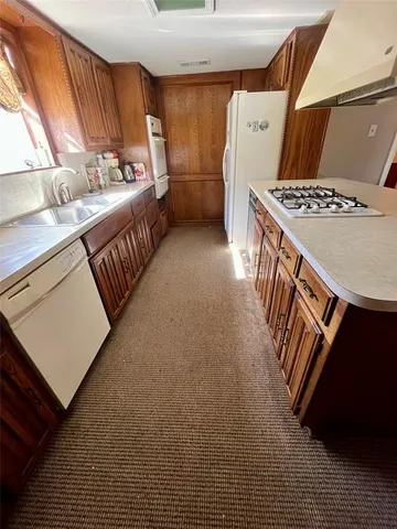 a view of a kitchen with furniture and window
