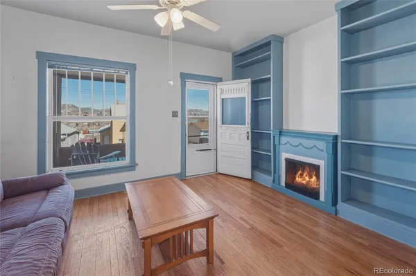 a bedroom with a bed and a fireplace