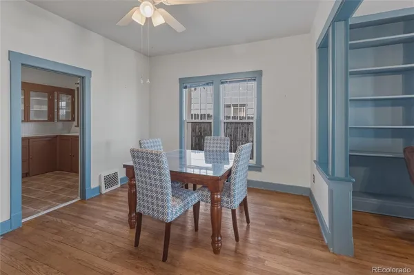 a view of a dining room with furniture window and wooden floor