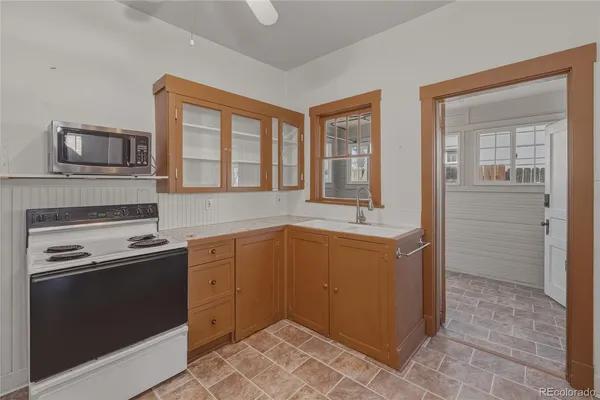 a kitchen with a stove microwave and refrigerator