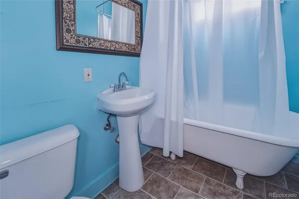 a bathroom with a sink and toilet