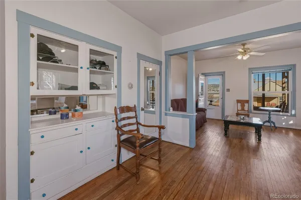 a view of a livingroom with furniture hardwood floor and a living room
