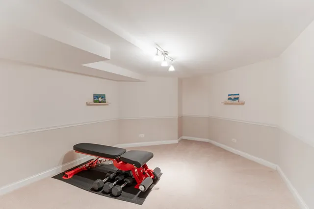 a room with a ceiling fan and a rug