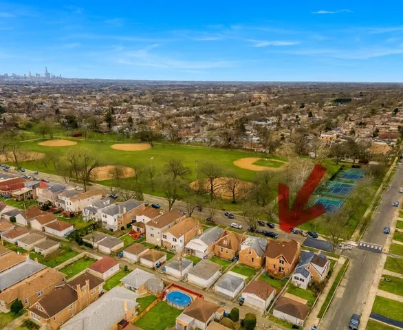 an aerial view of residential building and lake