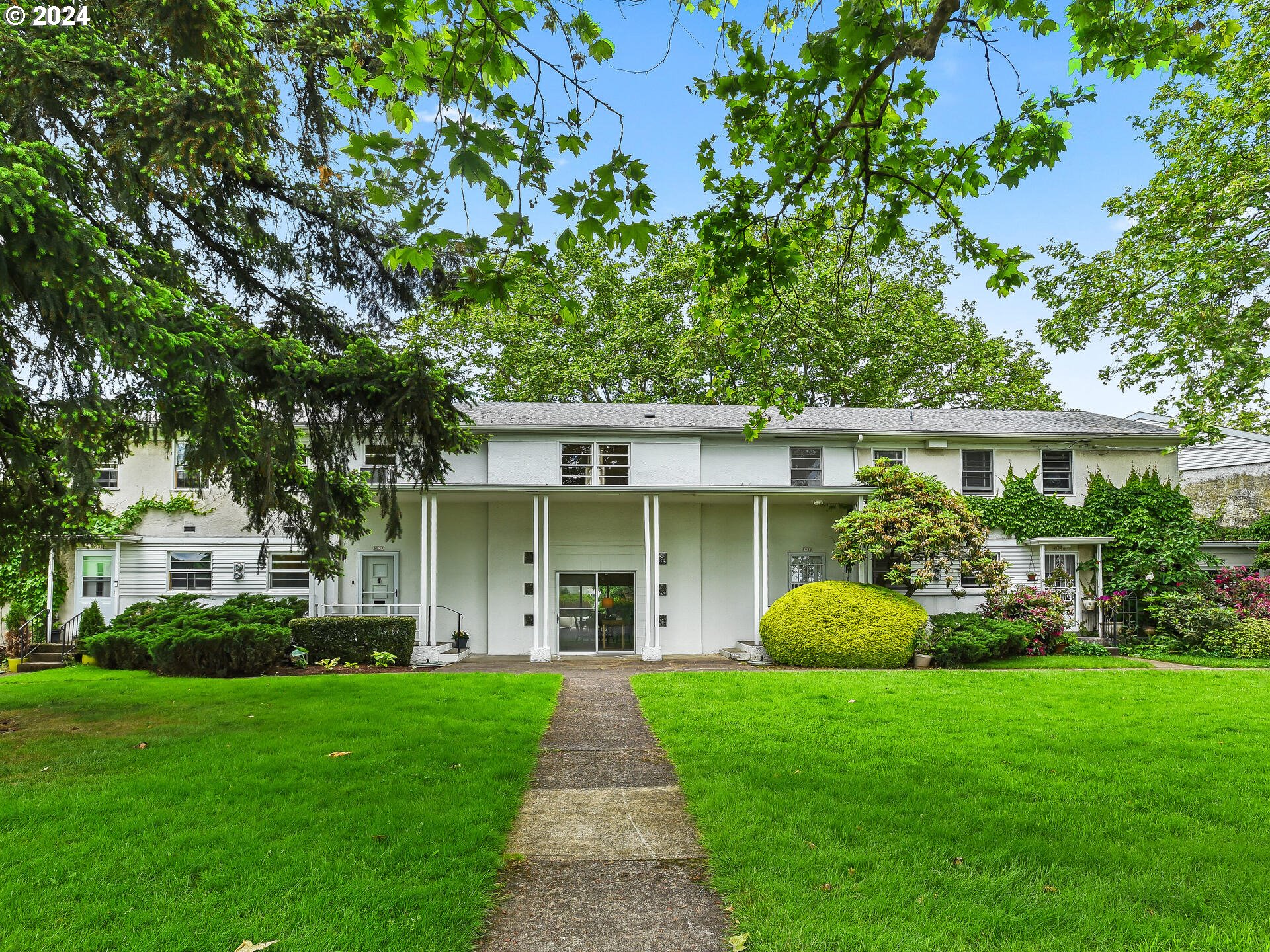 6937 Northeast Broadway Portland, OR 97213 - Photo 1 of 48 a view of a house with backyard and garden