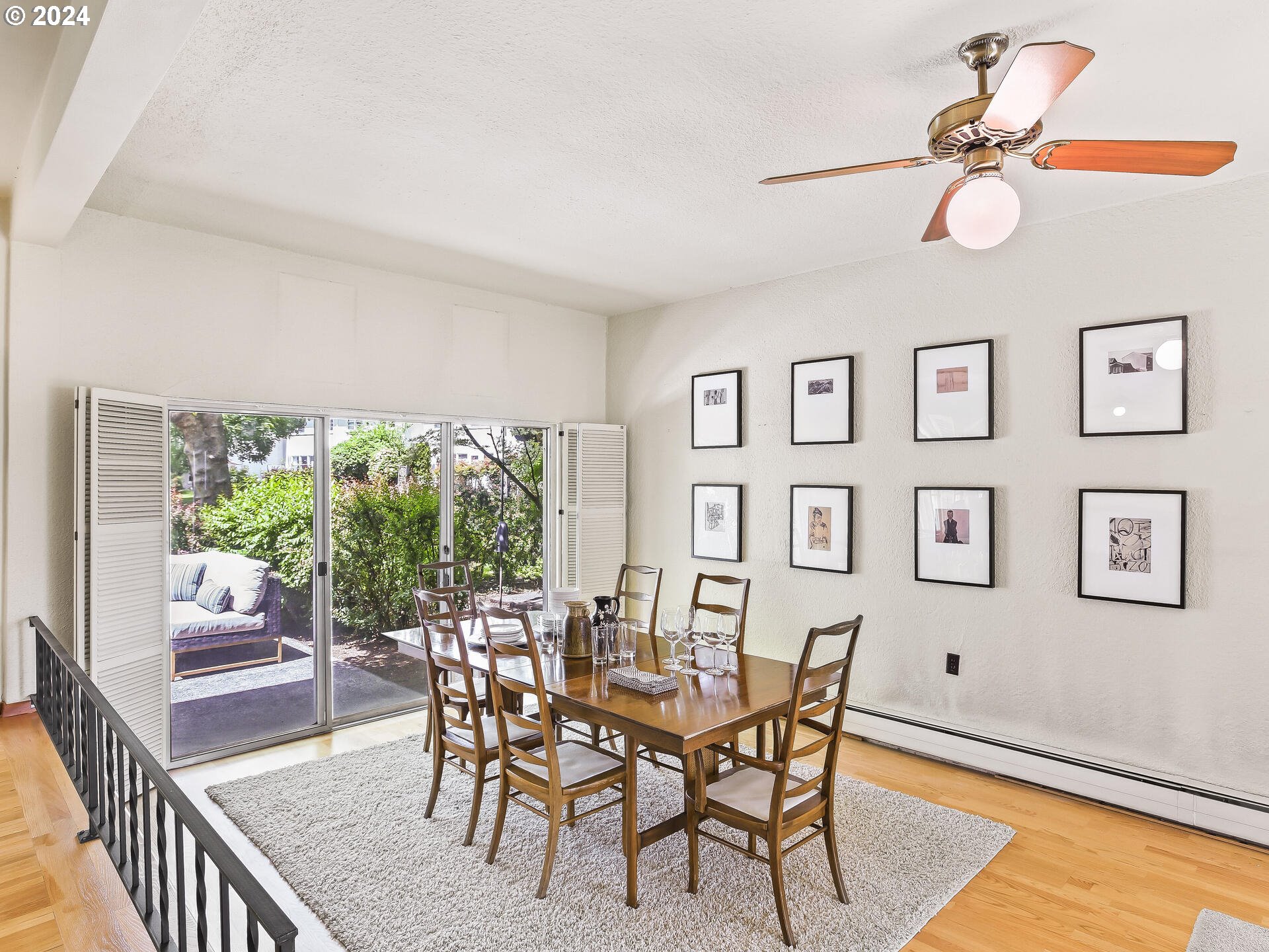 6937 Northeast Broadway Portland, OR 97213 - Photo 11 of 48 a dining room with furniture a rug and a floor to ceiling window