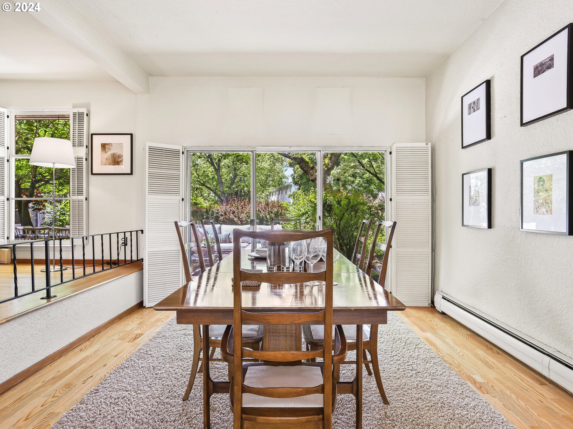 6937 Northeast Broadway Portland, OR 97213 - Photo 12 of 48 a view of a dining room with furniture window and wooden floor