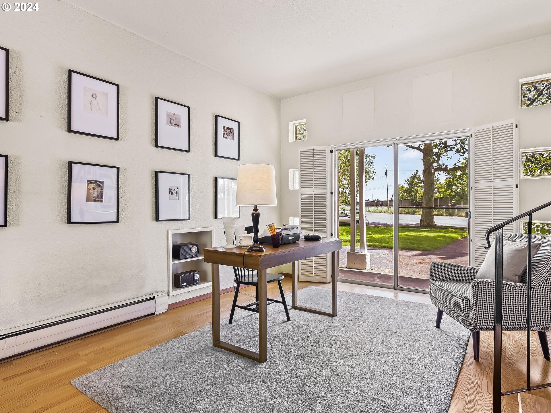 6937 Northeast Broadway Portland, OR 97213 - Photo 15 of 48 a workspace with furniture and a large window