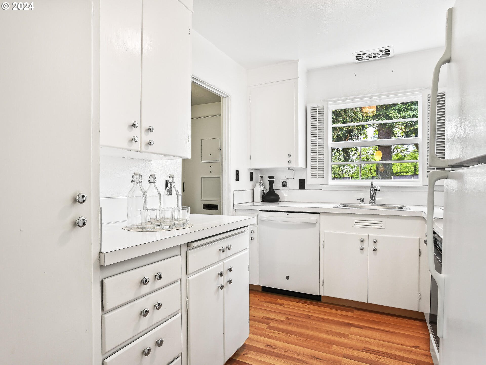 6937 Northeast Broadway Portland, OR 97213 - Photo 19 of 48 a spacious bathroom with double sink a large mirror and a window