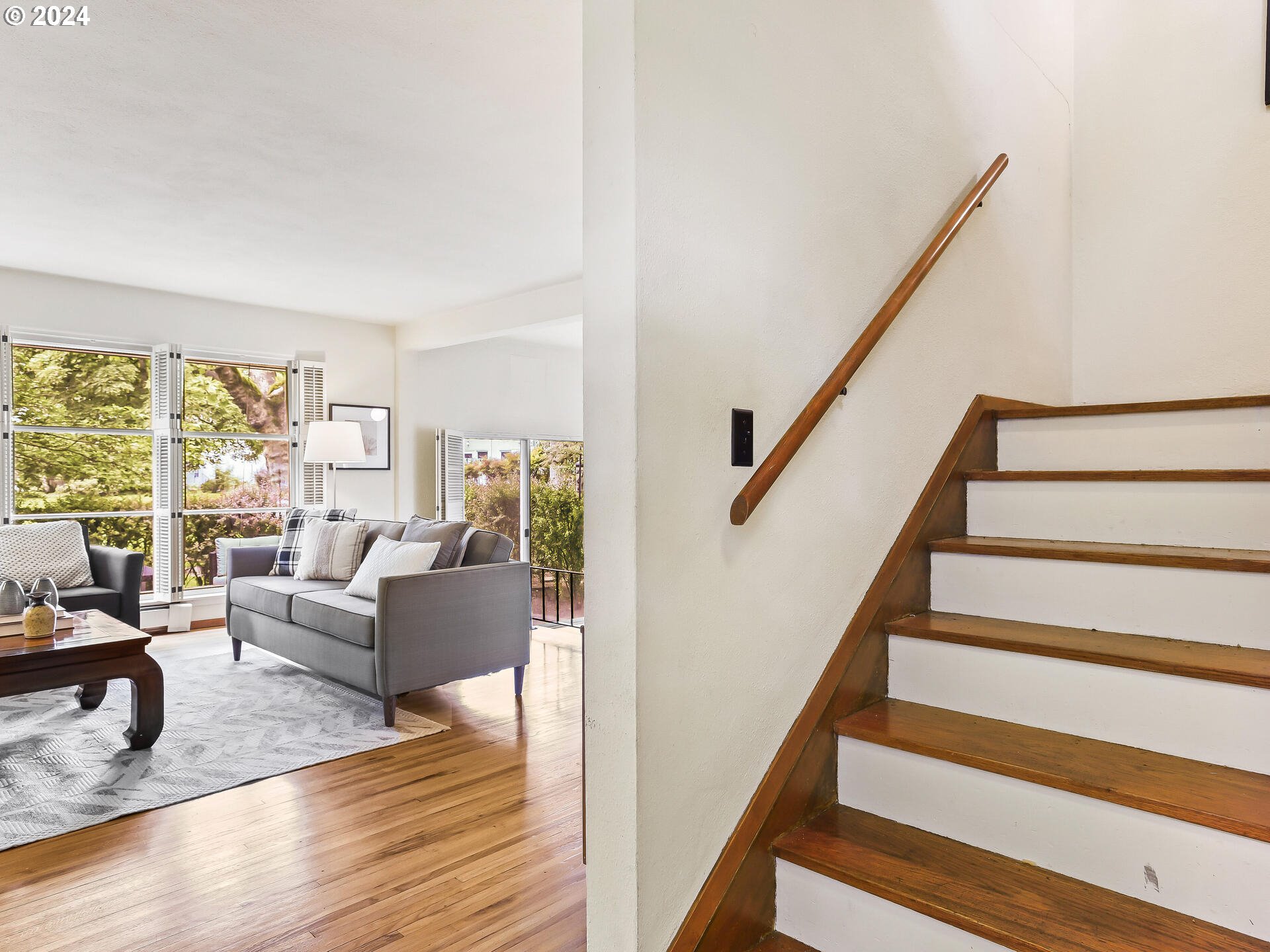 6937 Northeast Broadway Portland, OR 97213 - Photo 23 of 48 a living room with furniture and stairs