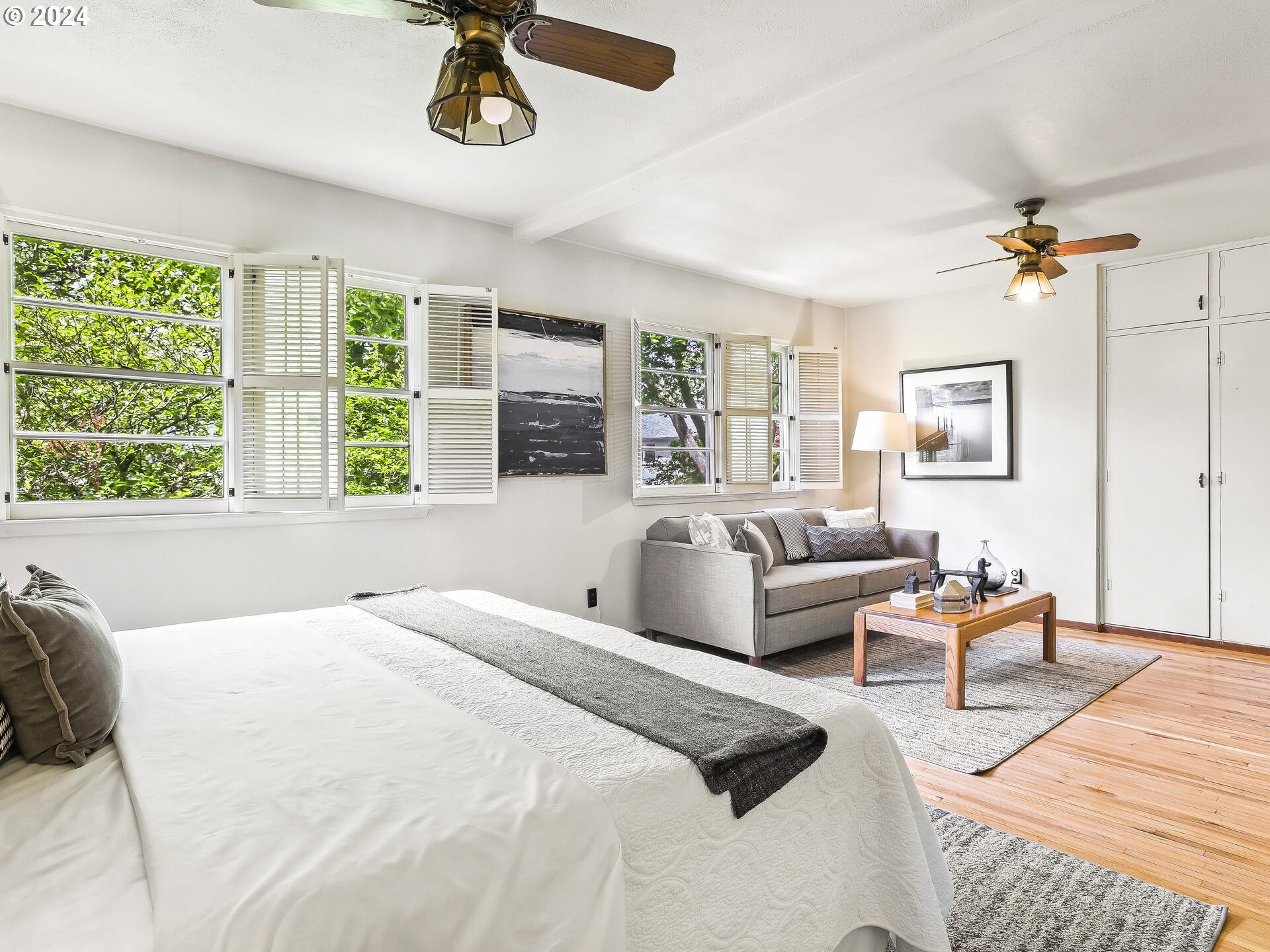 6937 Northeast Broadway Portland, OR 97213 - Photo 30 of 48 a bedroom with a bed a couch and a window