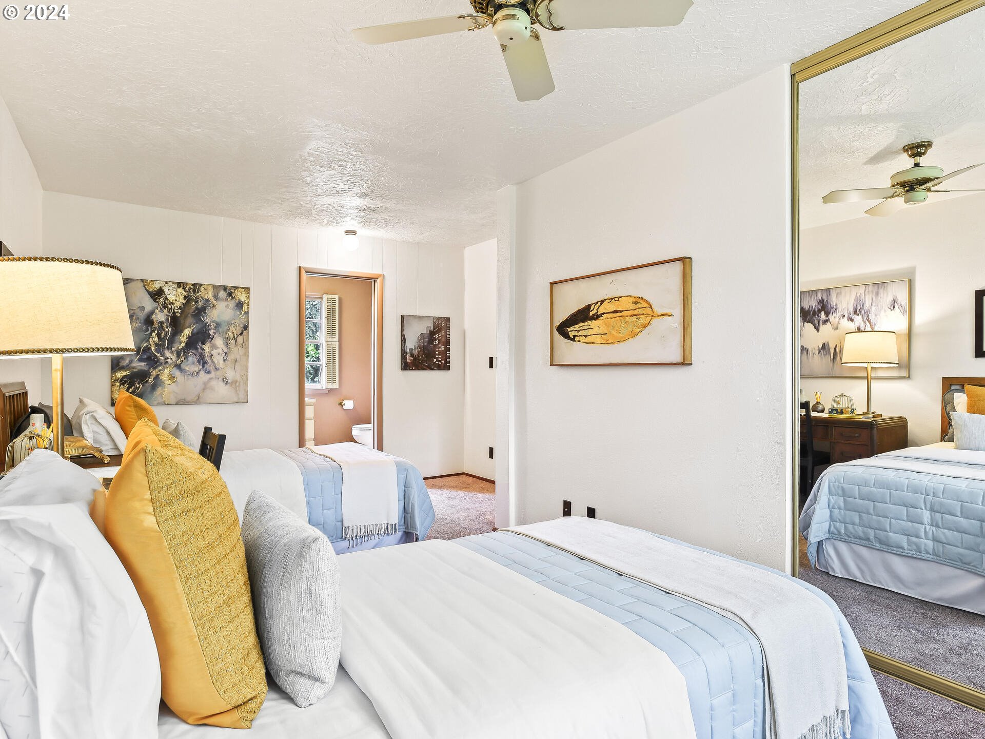 6937 Northeast Broadway Portland, OR 97213 - Photo 34 of 48 a bedroom with a bed and a chandelier