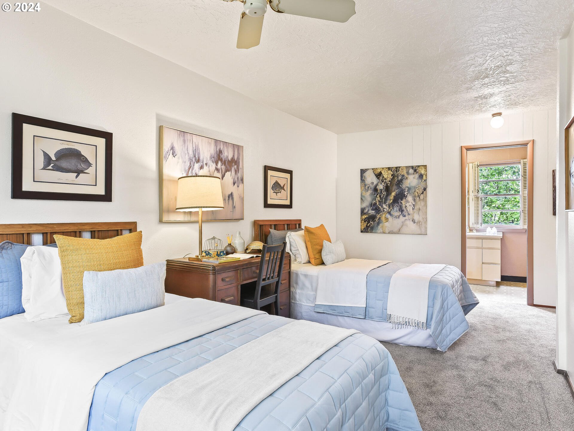 6937 Northeast Broadway Portland, OR 97213 - Photo 35 of 48 a bedroom with a large bed and three windows