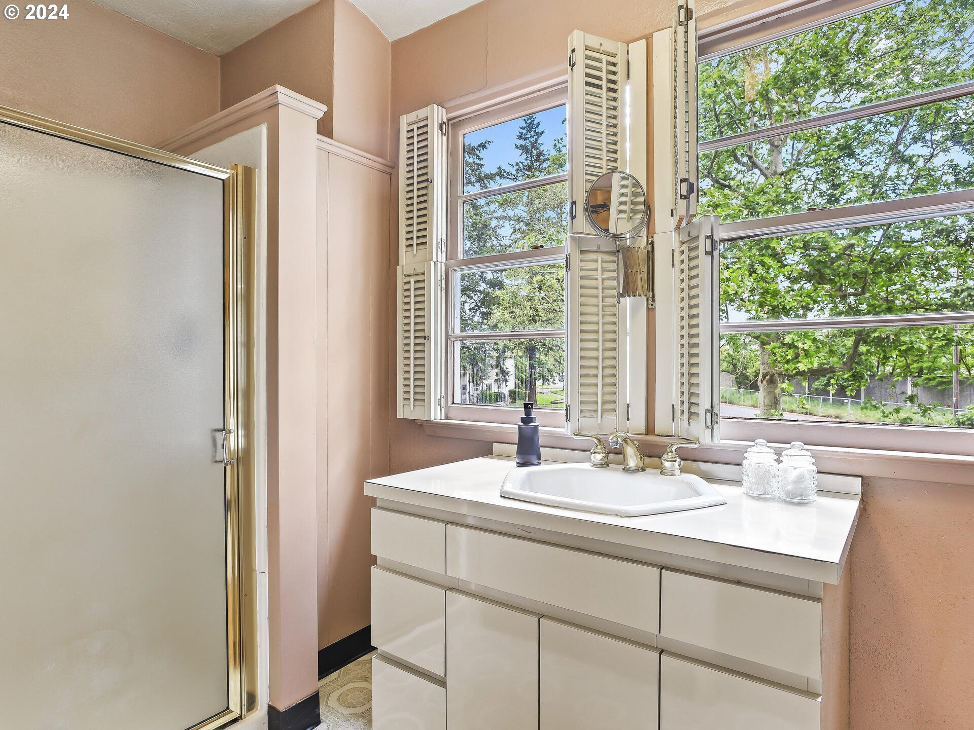 6937 Northeast Broadway Portland, OR 97213 - Photo 37 of 48 a bathroom with a sink and a window