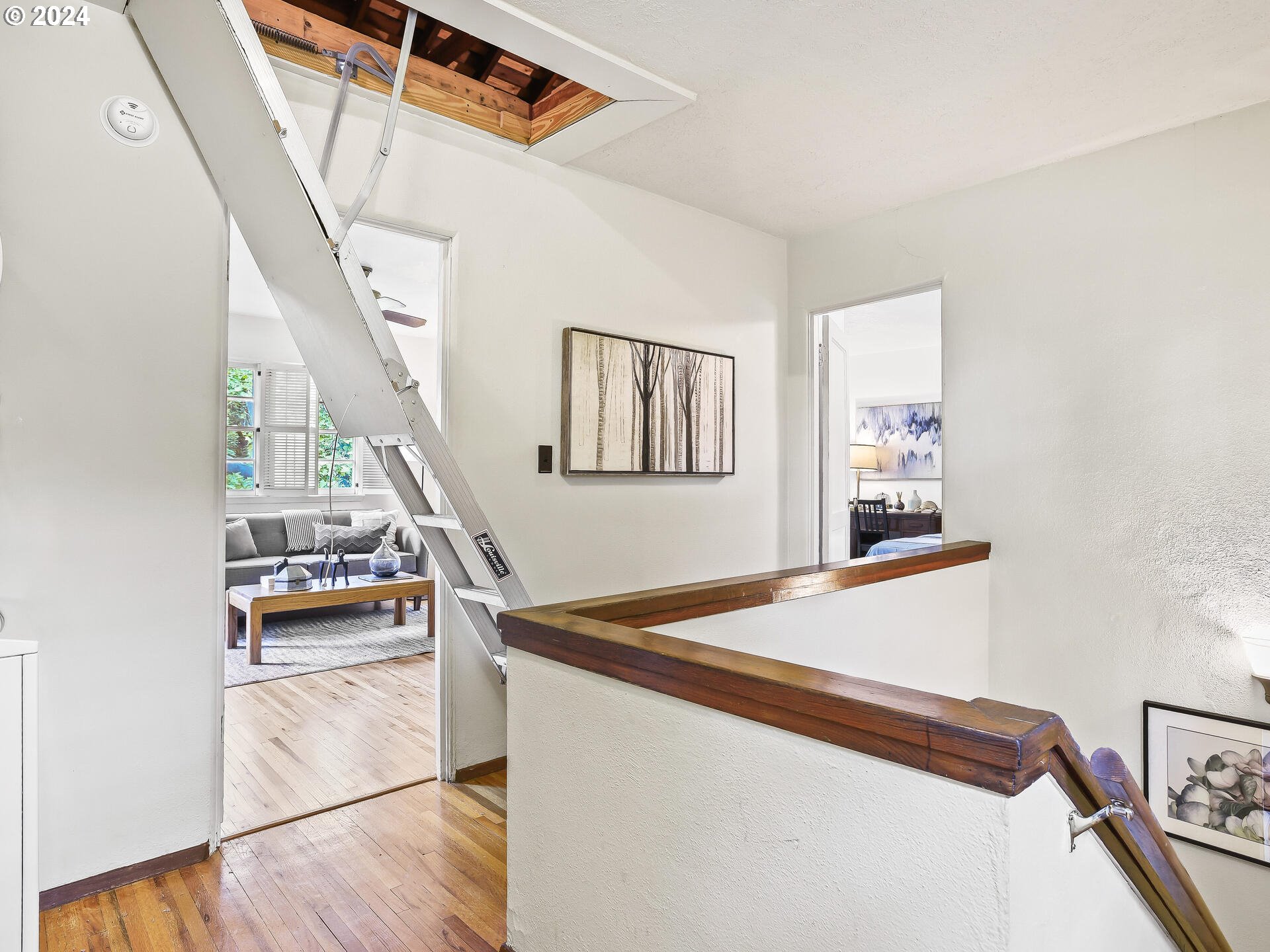 6937 Northeast Broadway Portland, OR 97213 - Photo 38 of 48 a view of a hallway with stairs and furniture