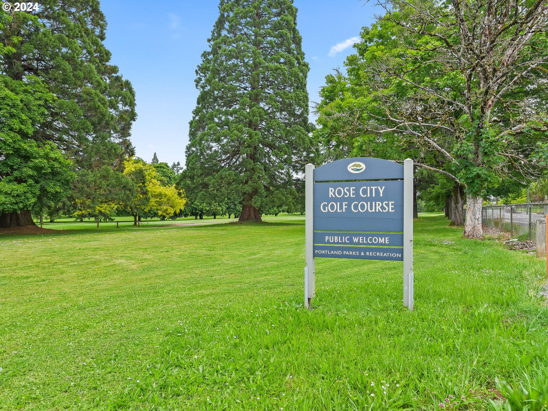 6937 Northeast Broadway Portland, OR 97213 - Photo 48 of 48 a view of a street with large trees