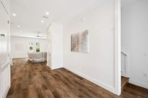 a view of swimming pool with seating space and hardwood floor