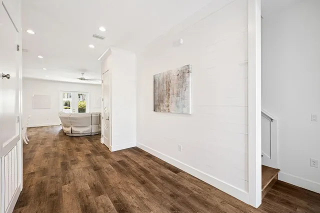 a view of swimming pool with seating space and hardwood floor