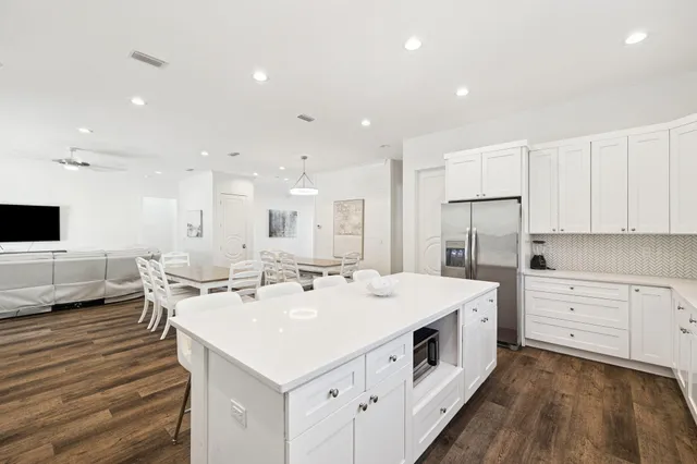 a white bath tub sitting next to a white sink