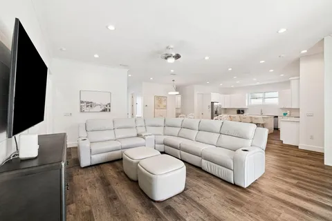 a bathroom with a granite countertop sink a toilet and a mirror