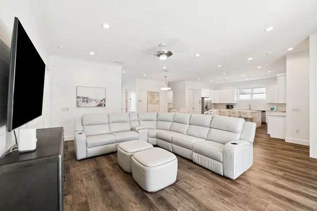 a bathroom with a granite countertop sink a toilet and a mirror